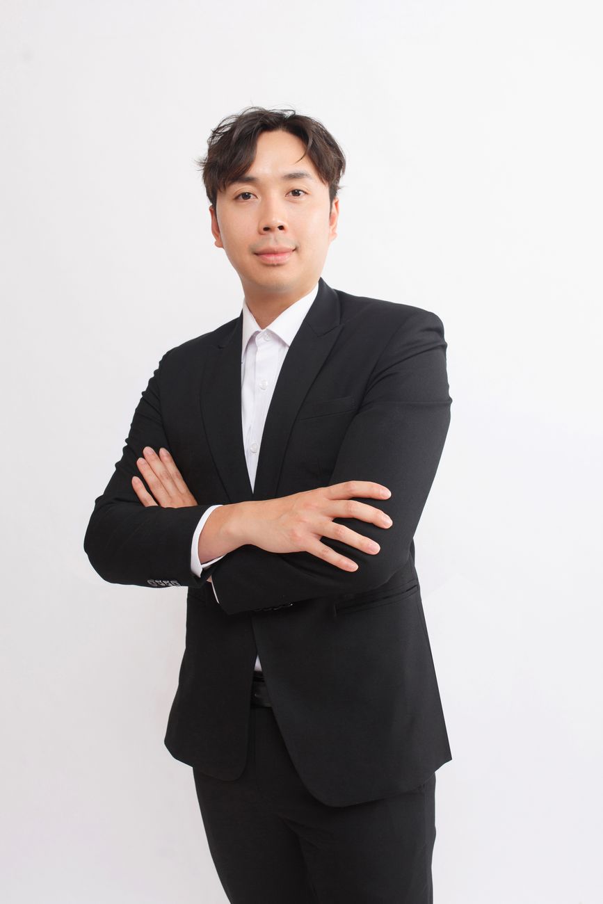 man in suit posing on white studio background