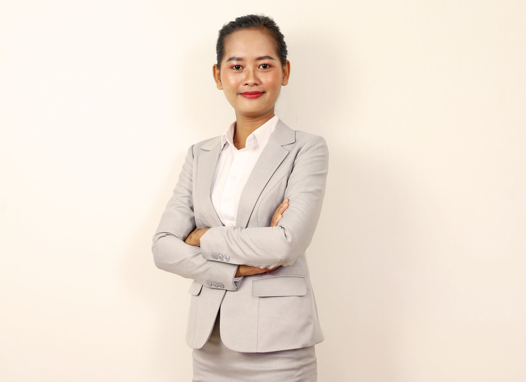 a standing woman in business attire